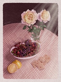 a bowl of fruit and a lemon on a table